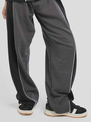 Haze Runner Trouser Hymns Wear – styled pose, white piping detail