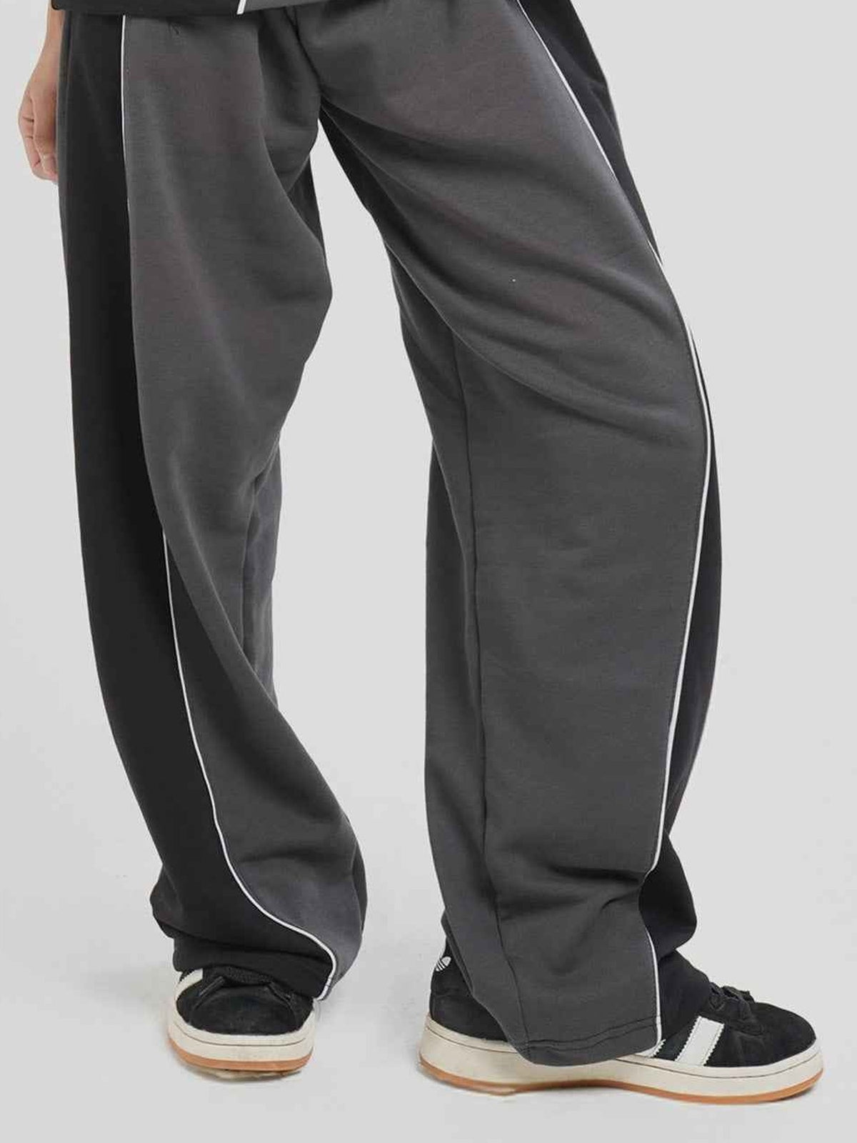 Haze Runner Trouser Hymns Wear – styled pose, white piping detail
